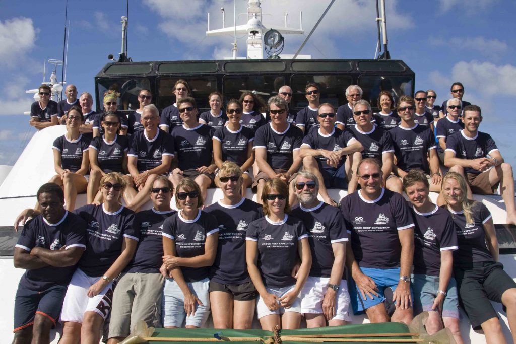 The expedition team and crew on the deck of the vessel