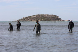 Right to left - SWF maritime archaeologist and director, Paul Hundley; Flinders Uni masters student, Tim Zapor; Department for Environments and Water Senior Maritime Heritage Officer, Rick Bullers; and Flinders Uni masters student, Madhumathy Chandrasekaran, undertaking a metal detector survey in the shallows within the search grid. Copyright: Irini Malliaros/Silentworld Foundation