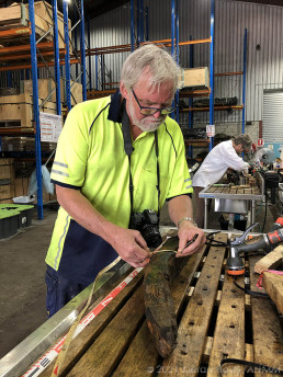 SWF senior maritime archaeologist, Paul Hundley, processes timbers for insertion into the record. Image: Kieran Hosty/ANMM