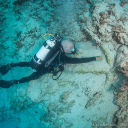 Kieran Hosty with an insitu anchor during the 2018 Boot Reef expedition. © Julia Sumerling/Silentworld Foundation.